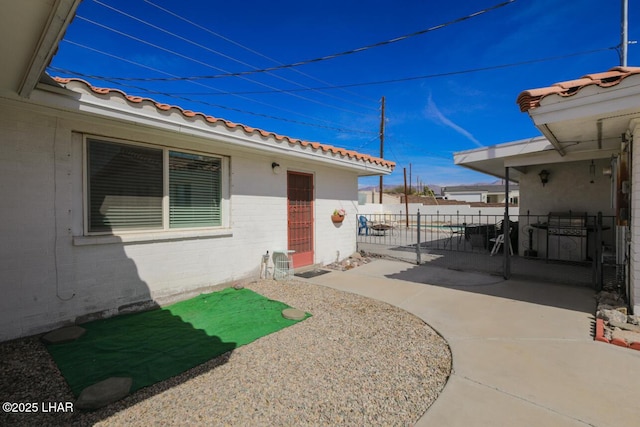 view of patio featuring fence