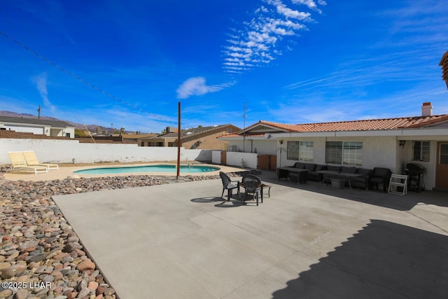 view of patio / terrace featuring a fenced backyard, grilling area, and a fenced in pool