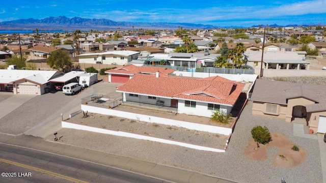 birds eye view of property with a residential view and a mountain view