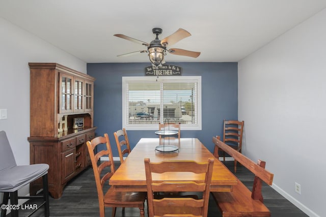 dining room with dark wood-style floors, ceiling fan, and baseboards