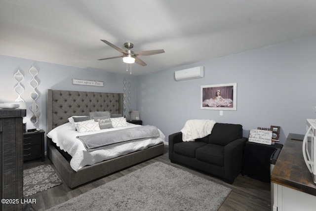 bedroom featuring a wall unit AC, ceiling fan, and dark wood finished floors