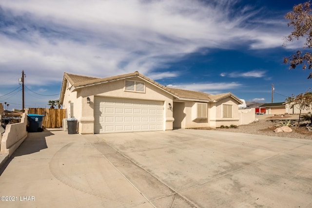 ranch-style home with a garage