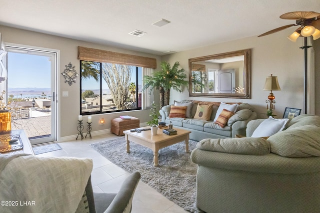 living room with light tile patterned flooring and ceiling fan