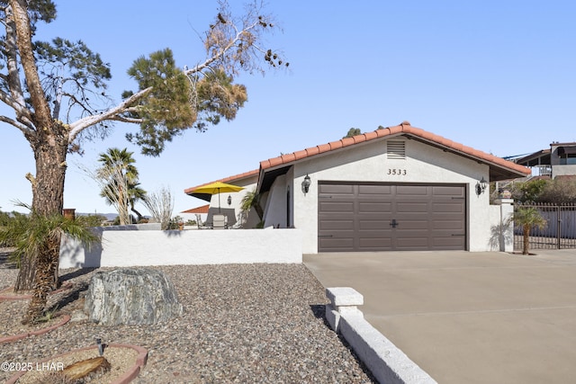 ranch-style home featuring a garage