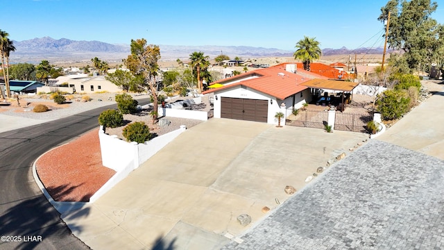 view of front of house featuring a mountain view and a garage