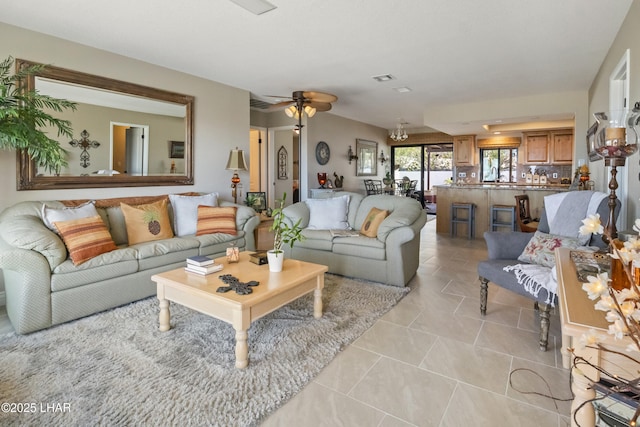 tiled living room featuring ceiling fan