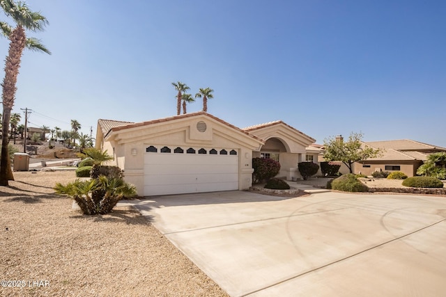 mediterranean / spanish-style house featuring a garage