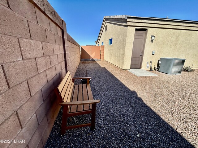 view of yard featuring central AC and a patio area