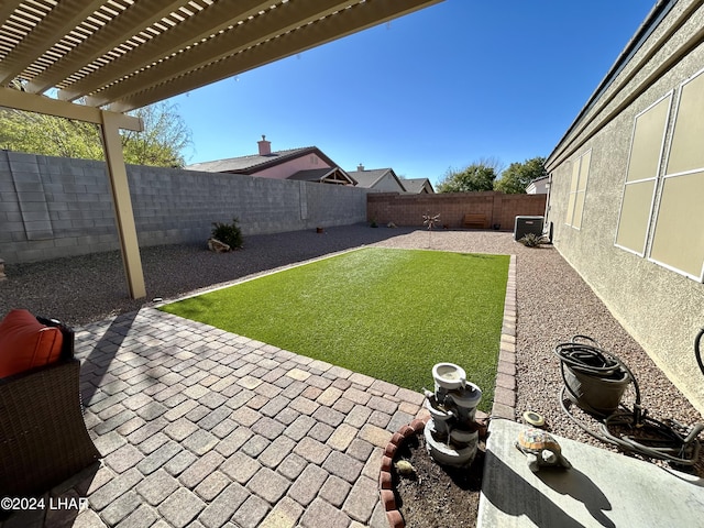 view of yard with a pergola and a patio area