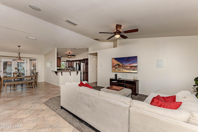 672 Wayside Dr, Lake Havasu City, AZ 86403 - living room with a ceiling fan, vaulted ceiling, and baseboards