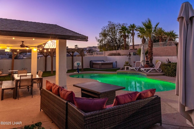 672 Wayside Dr, Lake Havasu City, AZ 86403 - pool at dusk with an outdoor hangout area, a patio area, a fenced backyard, and outdoor dining area