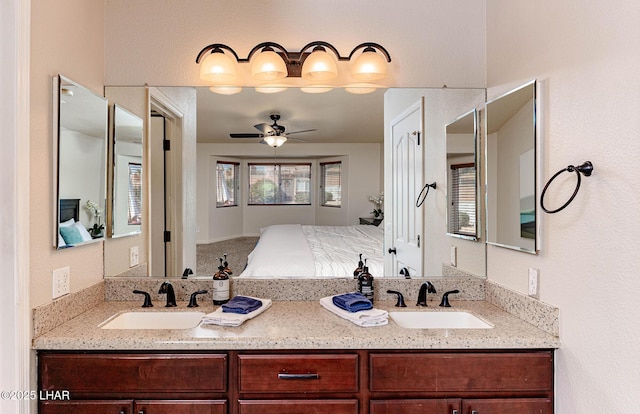 672 Wayside Dr, Lake Havasu City, AZ 86403 - bathroom featuring a ceiling fan and double vanity
