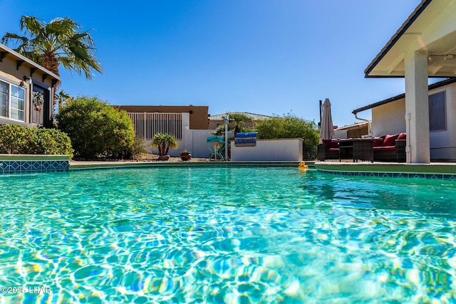 672 Wayside Dr, Lake Havasu City, AZ 86403 - outdoor pool with an outdoor living space and fence