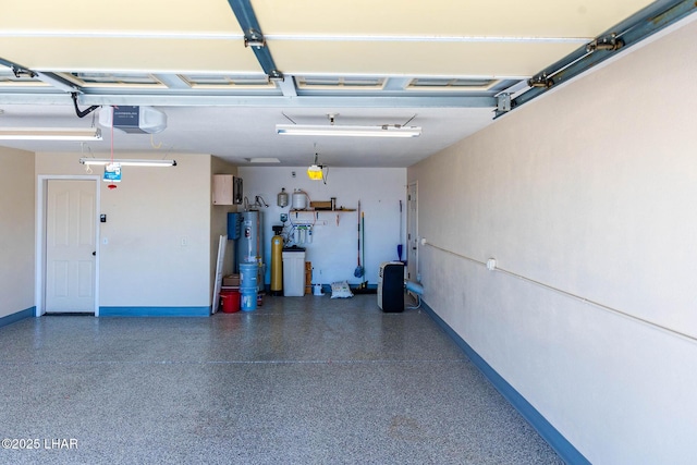 672 Wayside Dr, Lake Havasu City, AZ 86403 - garage with a garage door opener, gas water heater, and baseboards