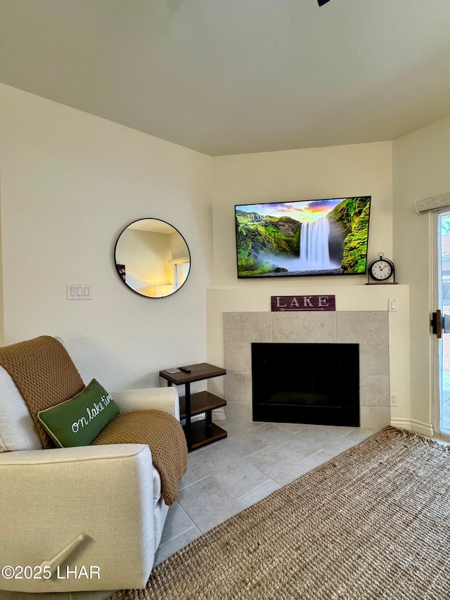 1650 S Smoketree Ave Unit 116, Lake Havasu City, AZ 86403 - living room with a tile fireplace and tile patterned flooring