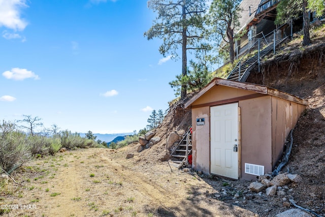 view of outdoor structure with a mountain view