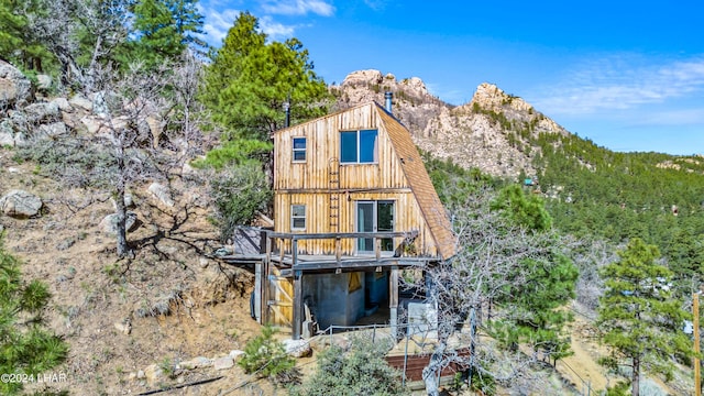 rear view of house with a mountain view