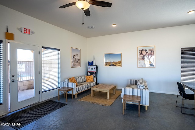 living area featuring ceiling fan