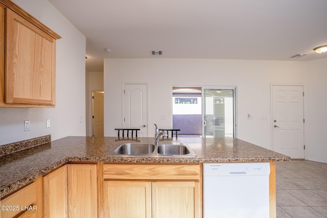 kitchen with light tile patterned flooring, light brown cabinetry, sink, white dishwasher, and kitchen peninsula