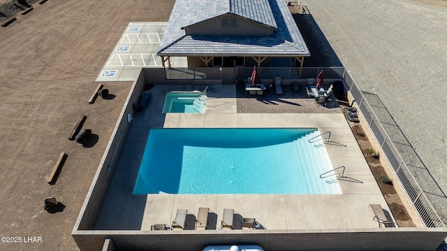 view of pool featuring a patio