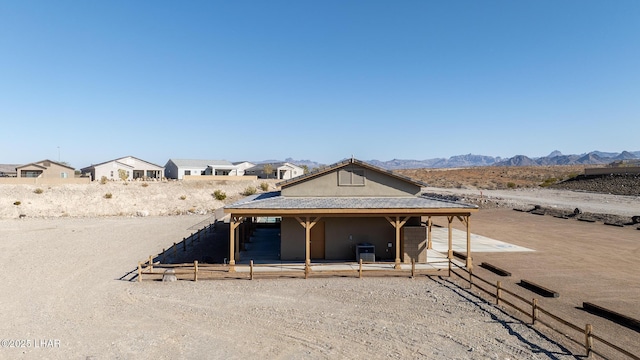 exterior space featuring central AC and a mountain view