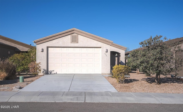 ranch-style house featuring a garage