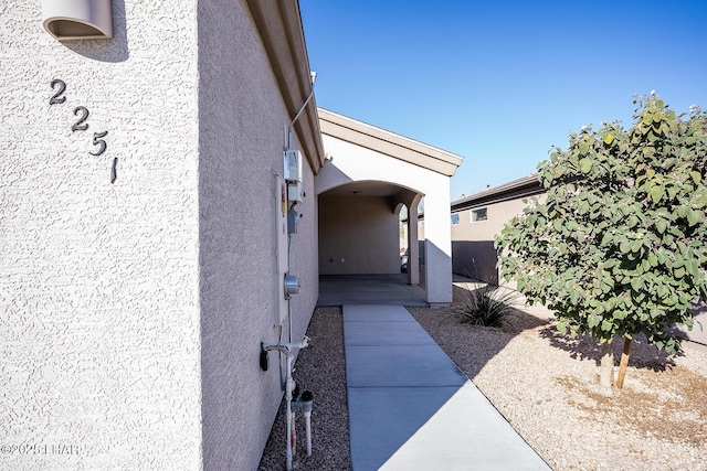 view of side of property with a patio