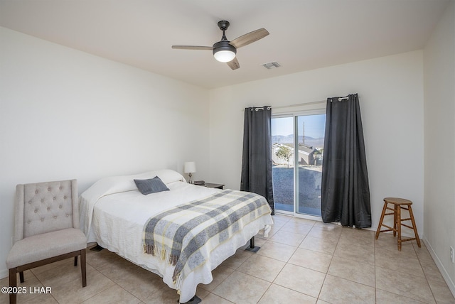 bedroom with light tile patterned flooring, access to exterior, and ceiling fan