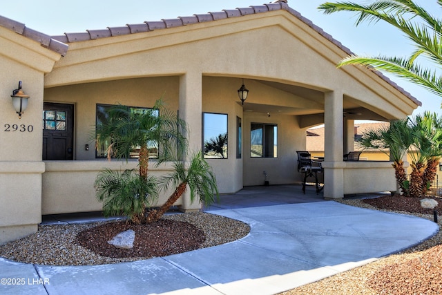 2930 Poseidon Ln, Lake Havasu City, AZ 86404 - view of exterior entry with stucco siding and a patio