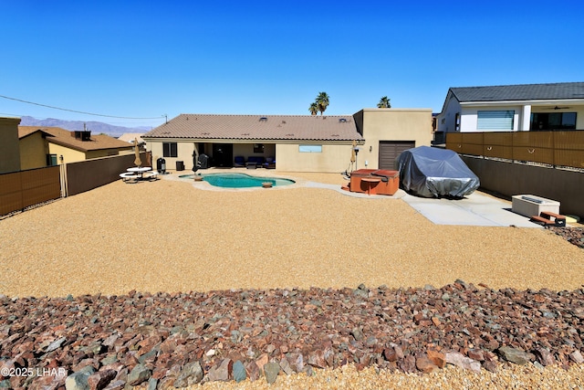 2930 Poseidon Ln, Lake Havasu City, AZ 86404 - back of property with a fenced backyard, a patio, stucco siding, and a tiled roof