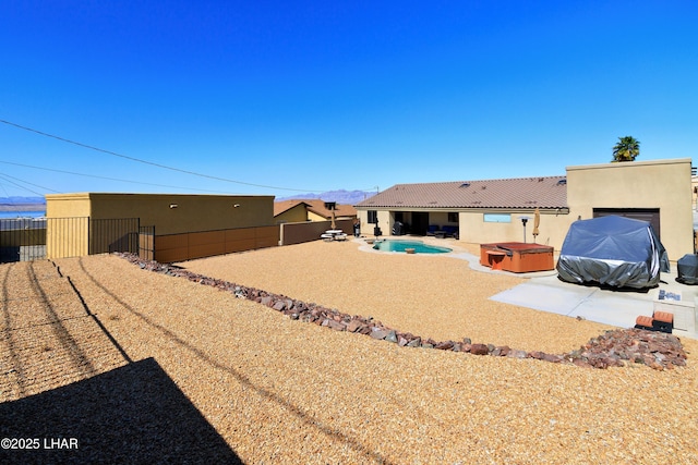 2930 Poseidon Ln, Lake Havasu City, AZ 86404 - fenced backyard with a hot tub and a patio