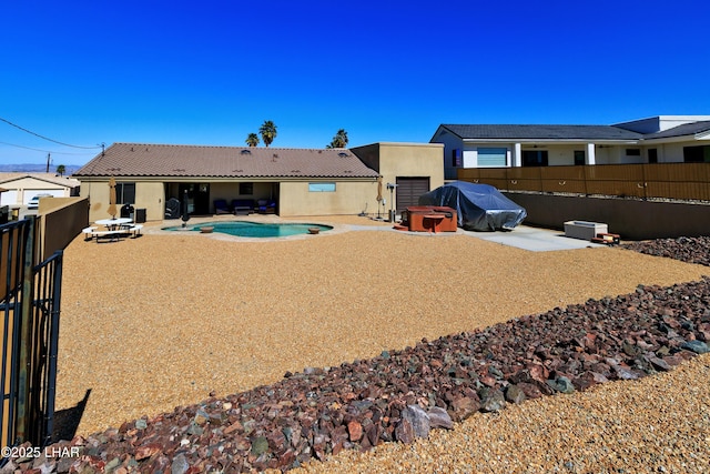 2930 Poseidon Ln, Lake Havasu City, AZ 86404 - rear view of house with stucco siding, a fenced backyard, and a patio