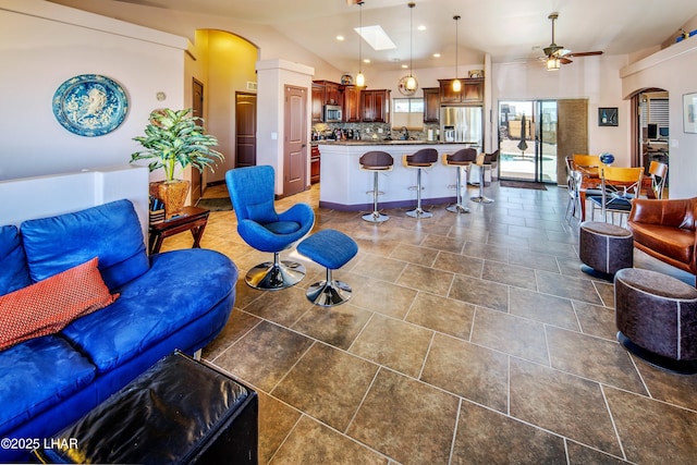 2930 Poseidon Ln, Lake Havasu City, AZ 86404 - living room with ceiling fan, vaulted ceiling, arched walkways, and recessed lighting
