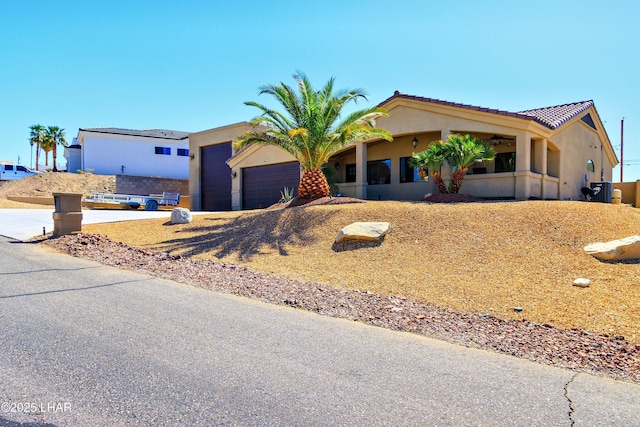 2930 Poseidon Ln, Lake Havasu City, AZ 86404 - view of front of house featuring stucco siding, a garage, and a tiled roof