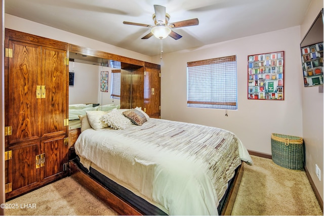 2930 Poseidon Ln, Lake Havasu City, AZ 86404 - bedroom with light colored carpet, baseboards, and a ceiling fan