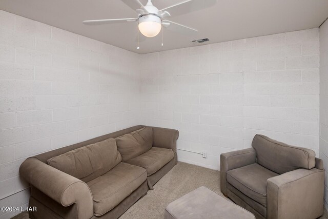living room featuring light carpet and ceiling fan