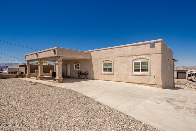 rear view of property with a patio area