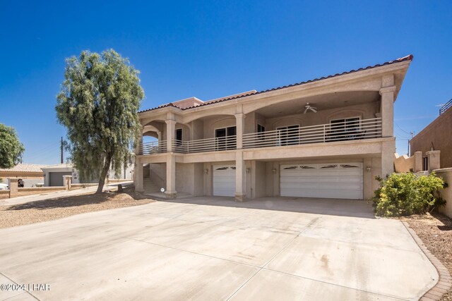 mediterranean / spanish-style house featuring a balcony and ceiling fan