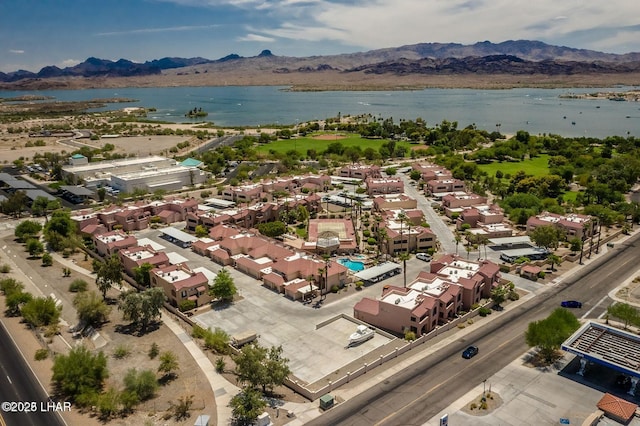 bird's eye view with a water and mountain view