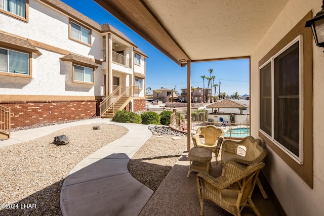 view of patio / terrace featuring an outdoor pool