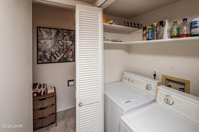 laundry room featuring laundry area, washing machine and clothes dryer, and tile patterned floors