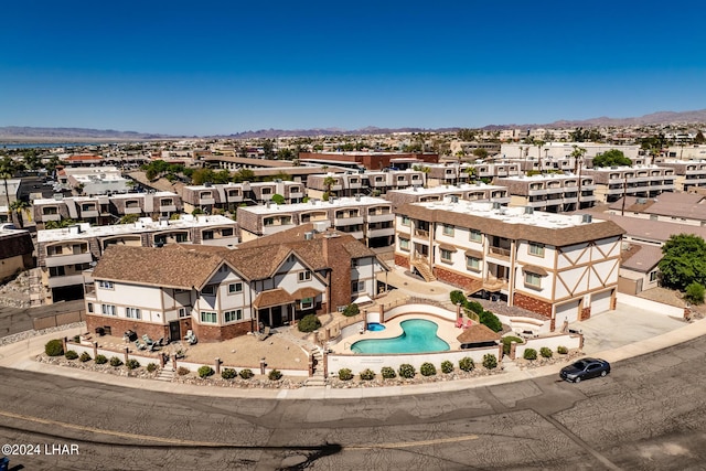 birds eye view of property with a mountain view and a residential view