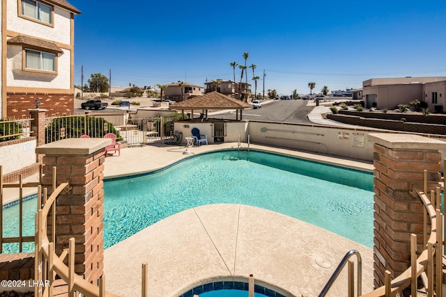 community pool featuring a patio area