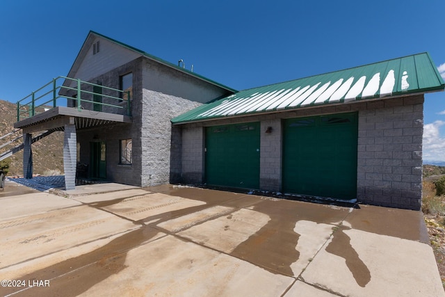 view of front of house with a balcony and a garage