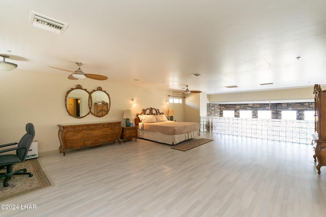 bedroom featuring light hardwood / wood-style floors and ceiling fan