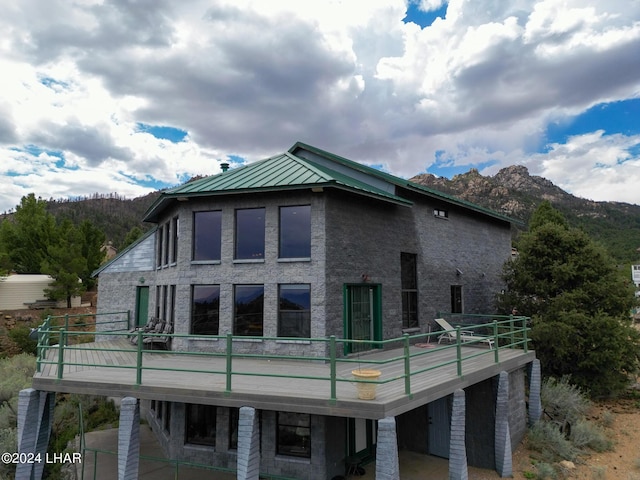 rear view of property with a mountain view