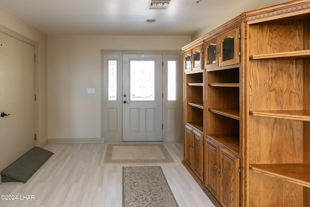 foyer entrance with light hardwood / wood-style flooring