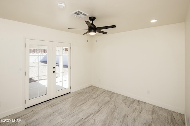 unfurnished room with baseboards, visible vents, ceiling fan, and french doors