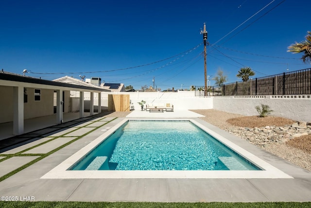 view of pool featuring a patio area, a fenced backyard, and a fenced in pool