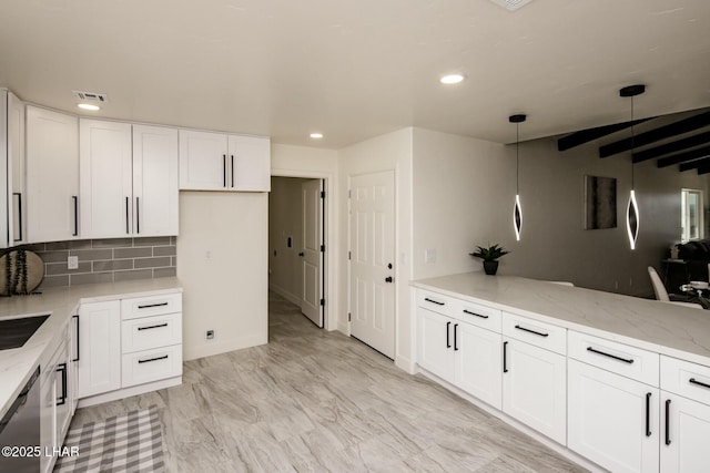 kitchen with visible vents, backsplash, white cabinetry, light stone countertops, and dishwasher